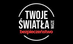 na czarnym tle biało czerwony napis twoje światła nasze bezpieczeństwo